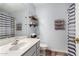 Bathroom features shower with modern curtain, decorative shelving, and decorative towel racks at 4837 E Whitehall Dr, San Tan Valley, AZ 85140