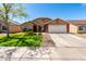 Charming single-story home featuring a well-manicured lawn, two-car garage, and inviting curb appeal at 4837 E Whitehall Dr, San Tan Valley, AZ 85140