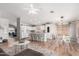 Bright, open concept kitchen features white cabinetry, an island with barstool seating and stainless steel appliances at 4837 E Whitehall Dr, San Tan Valley, AZ 85140