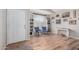Cozy living area with hardwood flooring, large window, and charming decor, creating a warm and inviting atmosphere at 4837 E Whitehall Dr, San Tan Valley, AZ 85140
