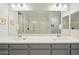 This spacious bathroom features double sinks, white countertops, ample cabinet space, and a modern shower at 5100 E Rancho Paloma Dr # 1029, Cave Creek, AZ 85331