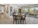Cozy dining area with tile-top table, barstool seating and sliding glass doors to the patio at 5100 E Rancho Paloma Dr # 1029, Cave Creek, AZ 85331