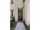 Home entrance with a solid front door, stone accents, and desert landscaping at 5100 E Rancho Paloma Dr # 1029, Cave Creek, AZ 85331