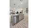 Kitchen with stainless steel appliances, granite countertops, and an adjacent sitting area at 5100 E Rancho Paloma Dr # 1029, Cave Creek, AZ 85331