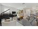 Living room with grand piano, television, fireplace and comfortable seating at 5100 E Rancho Paloma Dr # 1029, Cave Creek, AZ 85331