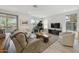 Bright and airy living room featuring a grand piano, comfortable seating, and desert views at 5100 E Rancho Paloma Dr # 1029, Cave Creek, AZ 85331