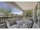 Inviting outdoor patio with a table and chairs, offering a view of the landscape and clear blue sky at 5100 E Rancho Paloma Dr # 1029, Cave Creek, AZ 85331
