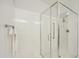Modern shower featuring frameless glass doors, white walls, updated fixtures, and a comfortable design at 5100 E Rancho Paloma Dr # 1029, Cave Creek, AZ 85331