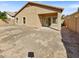 The backyard is large and spacious with a covered patio and ample room for activities at 5339 W Maldonado Rd, Laveen, AZ 85339