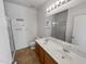 This bathroom has tile floors, a double sink vanity, and a glass enclosed shower at 5339 W Maldonado Rd, Laveen, AZ 85339