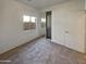 This bedroom has carpet floors, a window providing natural light, and closet with mirrored sliding doors at 5339 W Maldonado Rd, Laveen, AZ 85339