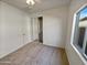 Cozy bedroom with carpet, a closet with mirrored doors, and natural light streaming through the window at 5339 W Maldonado Rd, Laveen, AZ 85339
