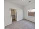 This bedroom has carpet floors, a window providing natural light, and a closet with ample storage space at 5339 W Maldonado Rd, Laveen, AZ 85339