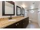 Bathroom with dual sinks, granite counters and tiled floors at 5507 E Kings Ave, Scottsdale, AZ 85254