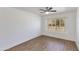 Bright bedroom featuring wood floors and a window with shutters at 5507 E Kings Ave, Scottsdale, AZ 85254