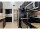 Updated kitchen with stainless steel appliances, granite countertops, and walk-in pantry at 5507 E Kings Ave, Scottsdale, AZ 85254