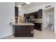 Modern kitchen with dark cabinetry, granite countertops, stainless steel appliances at 5507 E Kings Ave, Scottsdale, AZ 85254