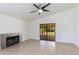 Cozy living room with a tiled fireplace and sliding glass doors to the outdoors at 5507 E Kings Ave, Scottsdale, AZ 85254