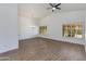 Bright, airy living room featuring vaulted ceilings, fan, and wood-look flooring at 5507 E Kings Ave, Scottsdale, AZ 85254
