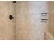 Modern shower with sleek tile design and convenient built-in shelving at 5507 E Kings Ave, Scottsdale, AZ 85254