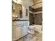 Beautifully remodeled bathroom features a mosaic tile shower-tub and vanity at 562 E Vesper Trl, Queen Creek, AZ 85140