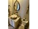 Charming powder room with stone sink and designer fixtures at 562 E Vesper Trl, Queen Creek, AZ 85140