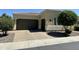 Charming single-Gathering home featuring a well-kept lawn and a two-car garage at 562 E Vesper Trl, Queen Creek, AZ 85140