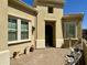 Home exterior featuring a decorative security door and manicured landscape at 562 E Vesper Trl, Queen Creek, AZ 85140