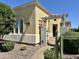 The home boasts a charming entry, complete with a decorative pergola and desert landscaping at 562 E Vesper Trl, Queen Creek, AZ 85140
