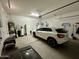 Spacious garage with car, storage, and water softener at 562 E Vesper Trl, Queen Creek, AZ 85140