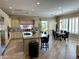 Open kitchen featuring an island with granite countertops, gas range, and stainless steel appliances at 562 E Vesper Trl, Queen Creek, AZ 85140