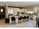 Bright kitchen boasts granite countertops, gas range, stainless appliances, and lots of cabinet space at 562 E Vesper Trl, Queen Creek, AZ 85140