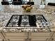 Close up of the Kitchen Island with a built in gas range and granite countertops at 562 E Vesper Trl, Queen Creek, AZ 85140