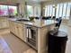 Kitchen with gas range, granite countertops, stainless steel appliances, and backyard views at 562 E Vesper Trl, Queen Creek, AZ 85140
