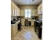 Spacious laundry room with custom cabinetry, countertops, and washer/dryer at 562 E Vesper Trl, Queen Creek, AZ 85140