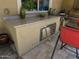 A fully equipped outdoor kitchen with counter space and stainless steel appliances for outdoor dining at 562 E Vesper Trl, Queen Creek, AZ 85140