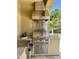 Built-in outdoor kitchen with stainless steel appliances and granite countertops, perfect for entertaining at 562 E Vesper Trl, Queen Creek, AZ 85140