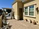A cozy patio with decorative chairs and plants and a pergola at 562 E Vesper Trl, Queen Creek, AZ 85140