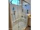 Bathroom featuring an updated tiled shower with glass door and shower head with bench at 562 E Vesper Trl, Queen Creek, AZ 85140
