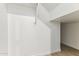 Walk-in closet featuring minimalist wire shelving and neutral colors at 5827 E Covey Ln, Phoenix, AZ 85054