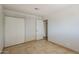 Bedroom featuring tile flooring and neutral color scheme with closet at 662 W Elena Ave, Mesa, AZ 85210