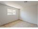 Bright bedroom with tile flooring and a window with neighborhood view at 662 W Elena Ave, Mesa, AZ 85210
