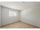 Bright bedroom with tile flooring and a window with neighborhood view at 662 W Elena Ave, Mesa, AZ 85210