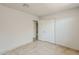 Bedroom featuring tile flooring and neutral color scheme with closet at 662 W Elena Ave, Mesa, AZ 85210