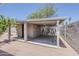 Attached carport with secure storage room, perfect for covered parking and additional space, blending functionality with design at 662 W Elena Ave, Mesa, AZ 85210