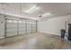 Spacious garage with a roll up door and plenty of room for parking at 662 W Elena Ave, Mesa, AZ 85210