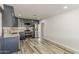 Updated kitchen features custom blue-gray cabinets, stainless steel appliances, and modern backsplash at 662 W Elena Ave, Mesa, AZ 85210