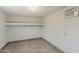 Simple room with tiled floor, built-in shelves, and air conditioning unit, offering functionality with a clean, minimalistic design at 662 W Elena Ave, Mesa, AZ 85210