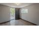 Tiled room with natural light entering through an open door and window, creating a bright and inviting interior at 662 W Elena Ave, Mesa, AZ 85210
