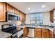 Well-maintained kitchen features stainless steel appliances and granite countertops at 700 E Mesquite Cir # J135, Tempe, AZ 85288